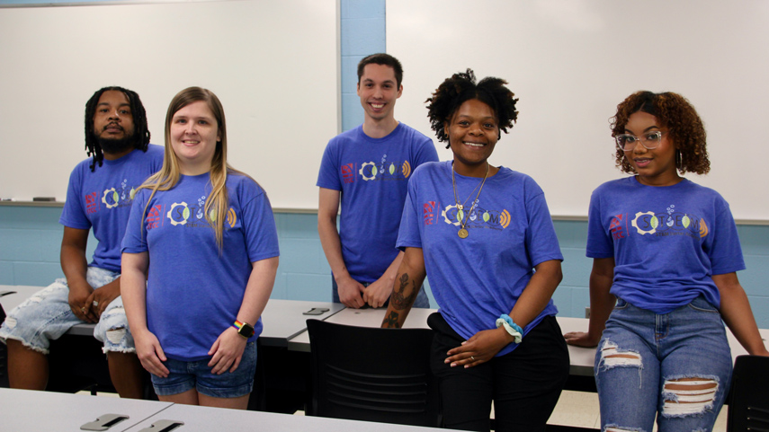 STEM Starter Academy students in front of a classroom