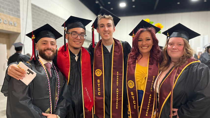 student leaders in graduation caps and gowns at the 2024 commencement