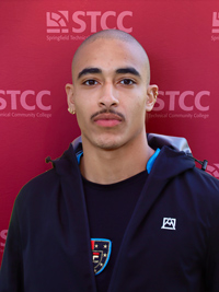 Aczel Reyes headshot looking very well photoshoped onto the STCC backdrop