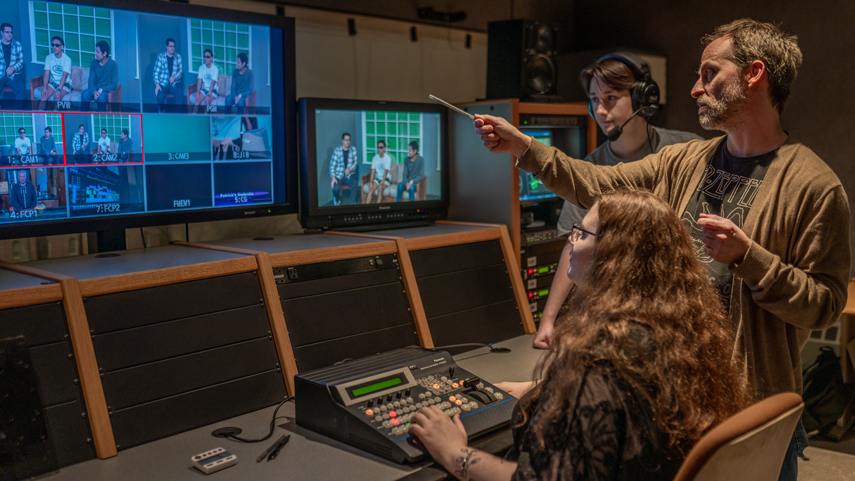 video production professor and students in studio