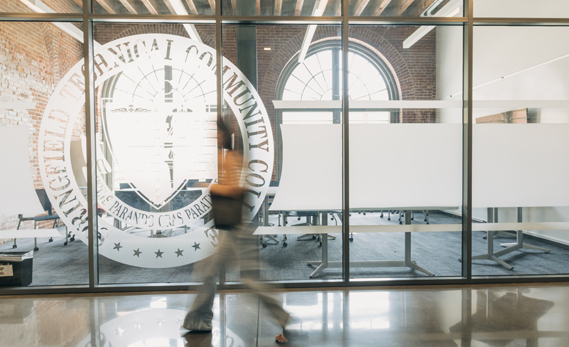 college student walking by student activities conference room in a blur