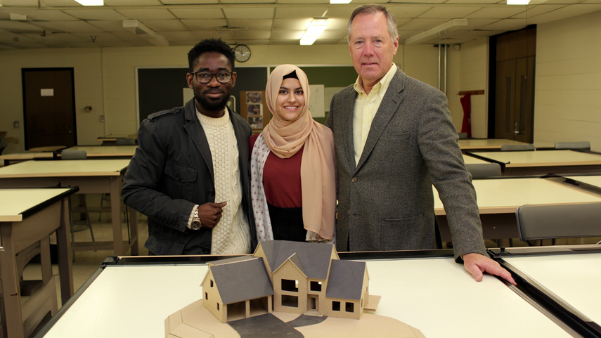 Architecture Students with professor and model
