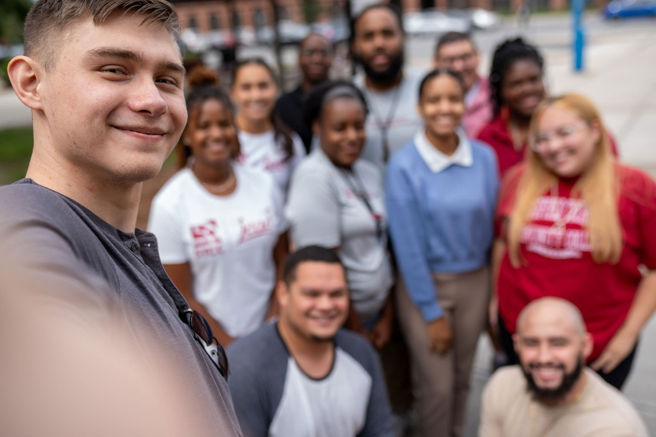 group of students smiling for a selfie