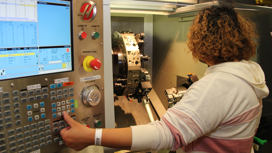 Student using 4-Axis-Lathe Machine