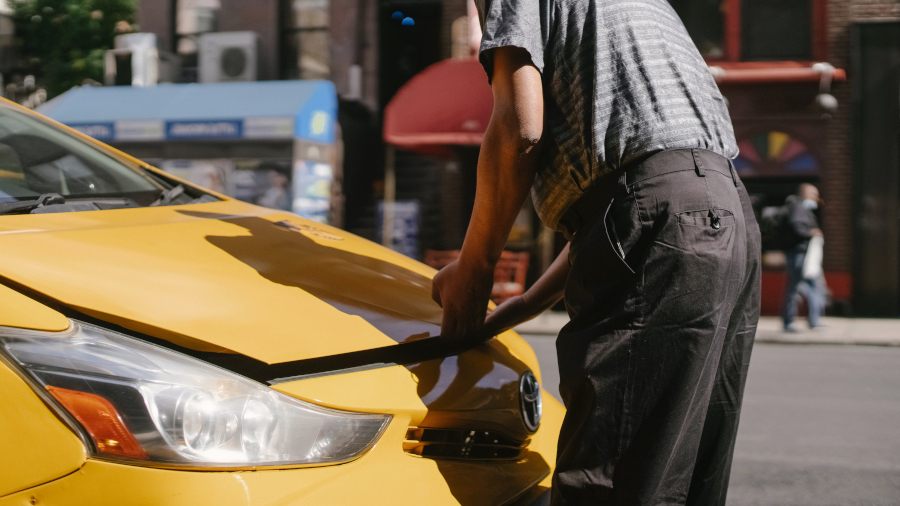 man opening car hood