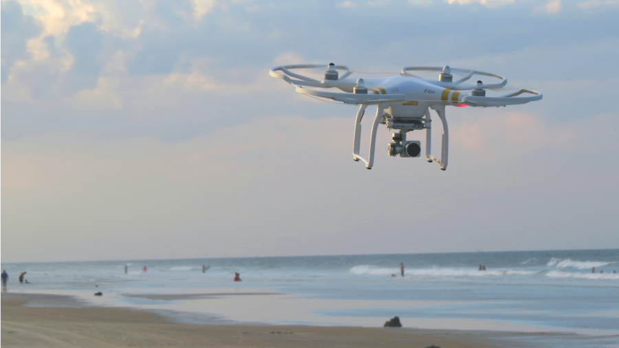 drone flying over beach
