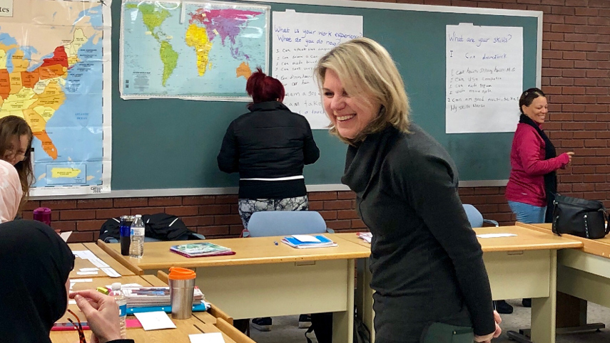 ESOL class in session with professor coming around to work with students